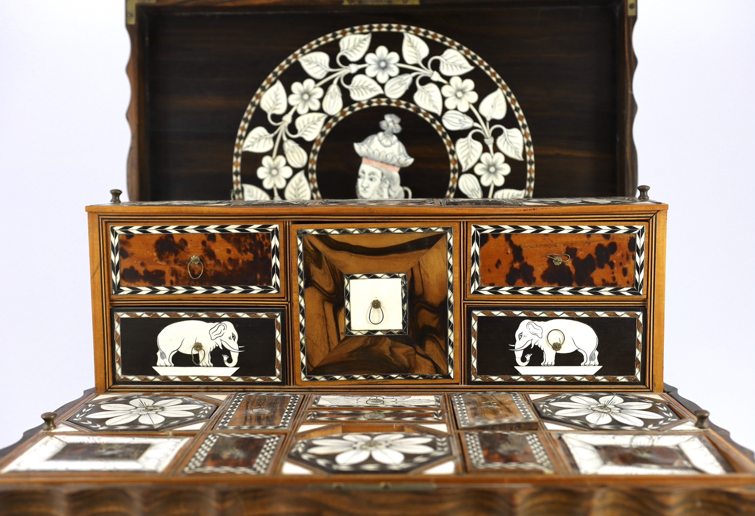 A mid 19th century Anglo Indian ivory inset ebony and other exotic hardwood travelling casket, 44cm wide 32cm deep 19cm high